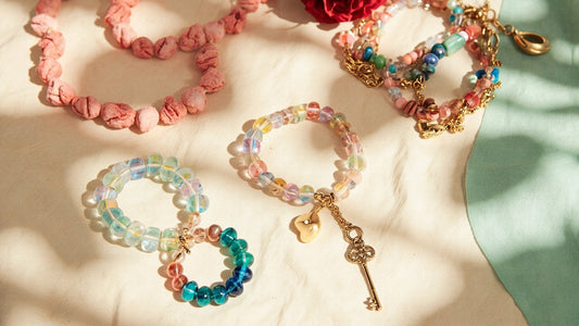 handcrafted beaded bracelets and charm keychain glowing in bright natural sunlight