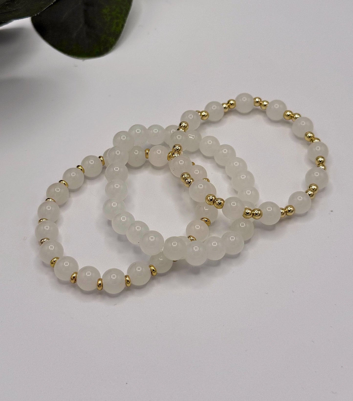 Casual Luxe: White Frosted Glass Bead Bracelet with Gold Spacers