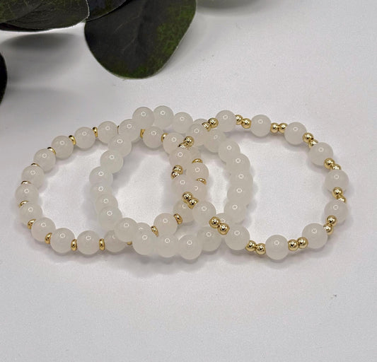 Casual Luxe: White Frosted Glass Bead Bracelet with Gold Spacers