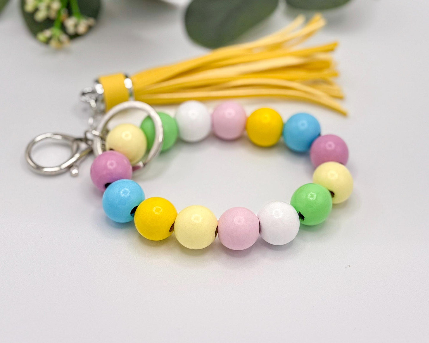 Pastel Charm Stretchy Wooden Bead Keychain with Tassel Flair