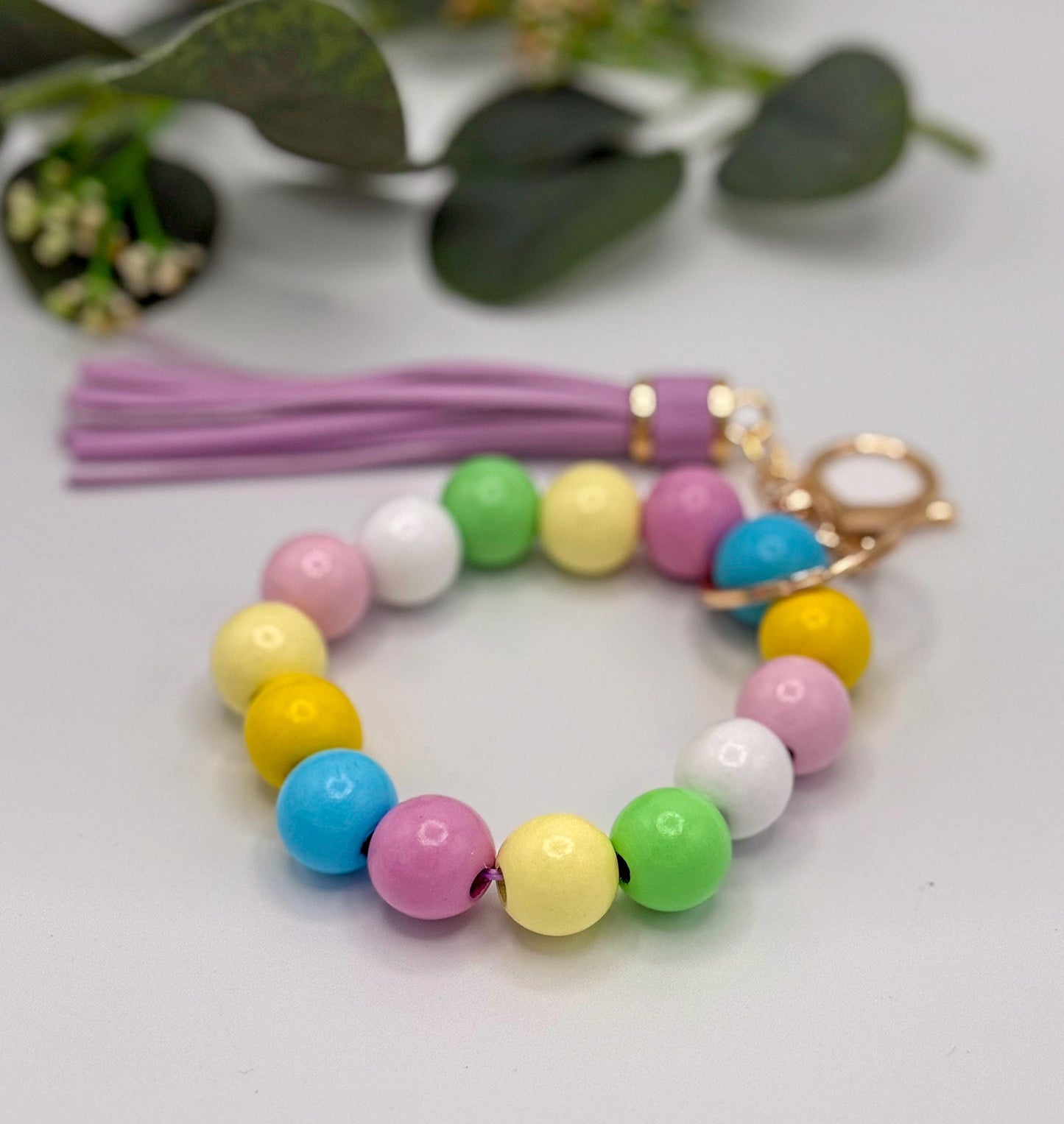 Pastel Charm Stretchy Wooden Bead Keychain with Tassel Flair