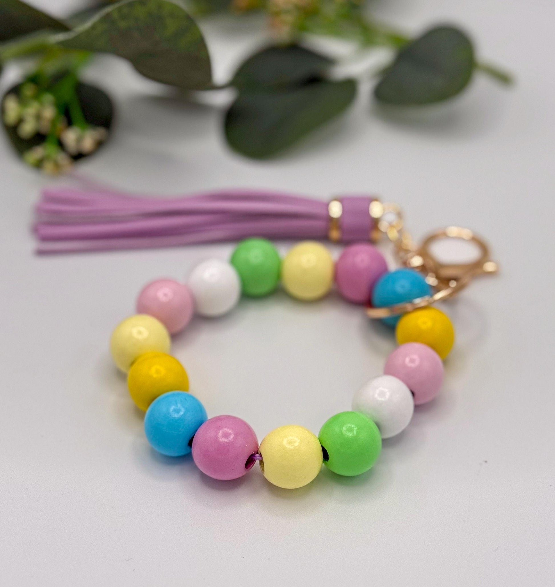 Pastel Charm Stretchy Wooden Bead Keychain with Tassel Flair