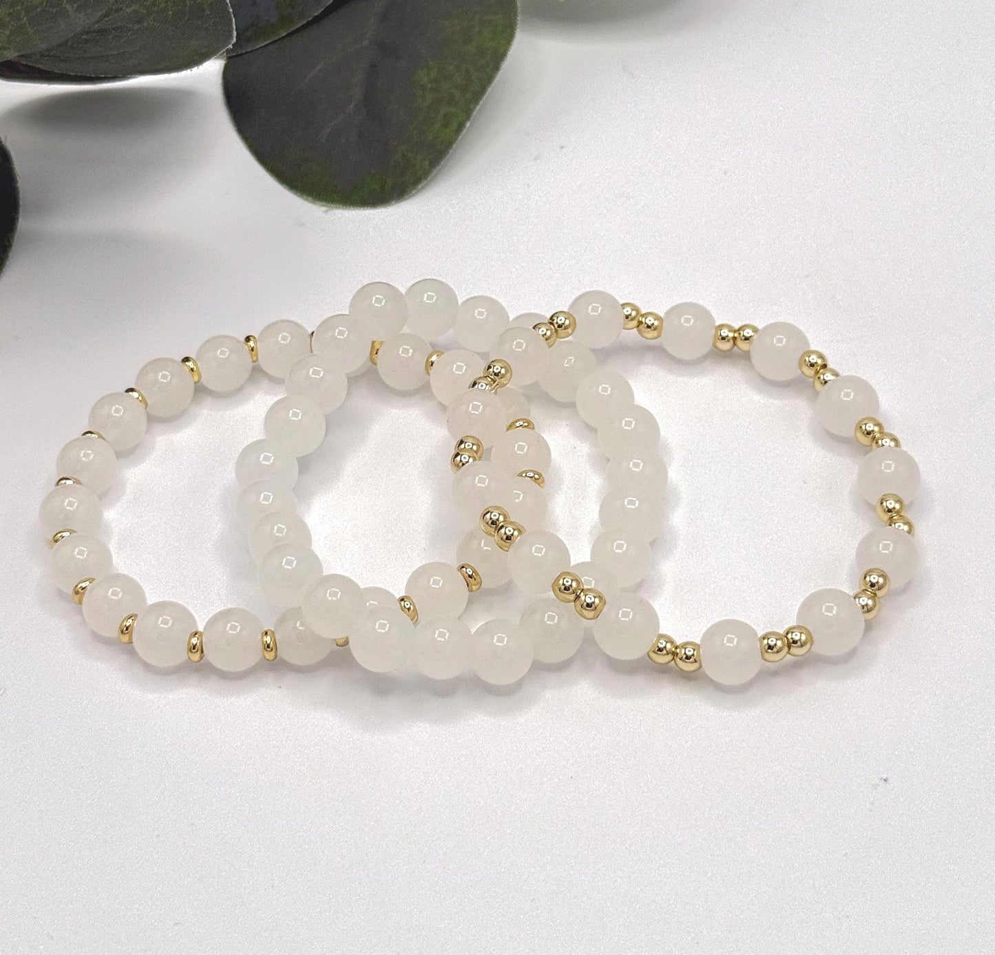 Casual Luxe: White Frosted Glass Bead Bracelet with Gold Spacers - Stretchy, No Clasp Design