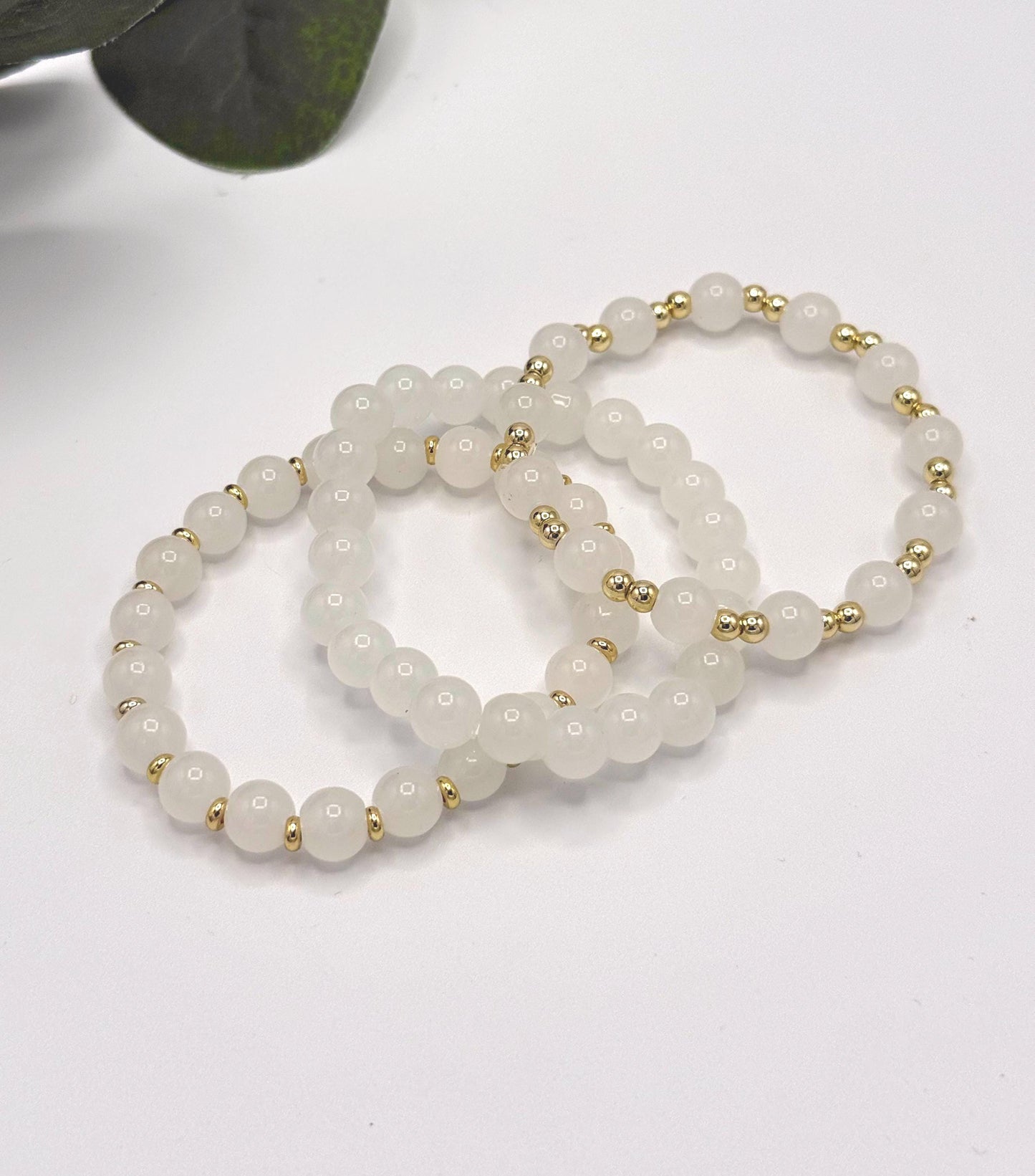 Casual Luxe: White Frosted Glass Bead Bracelet with Gold Spacers - Stretchy, No Clasp Design