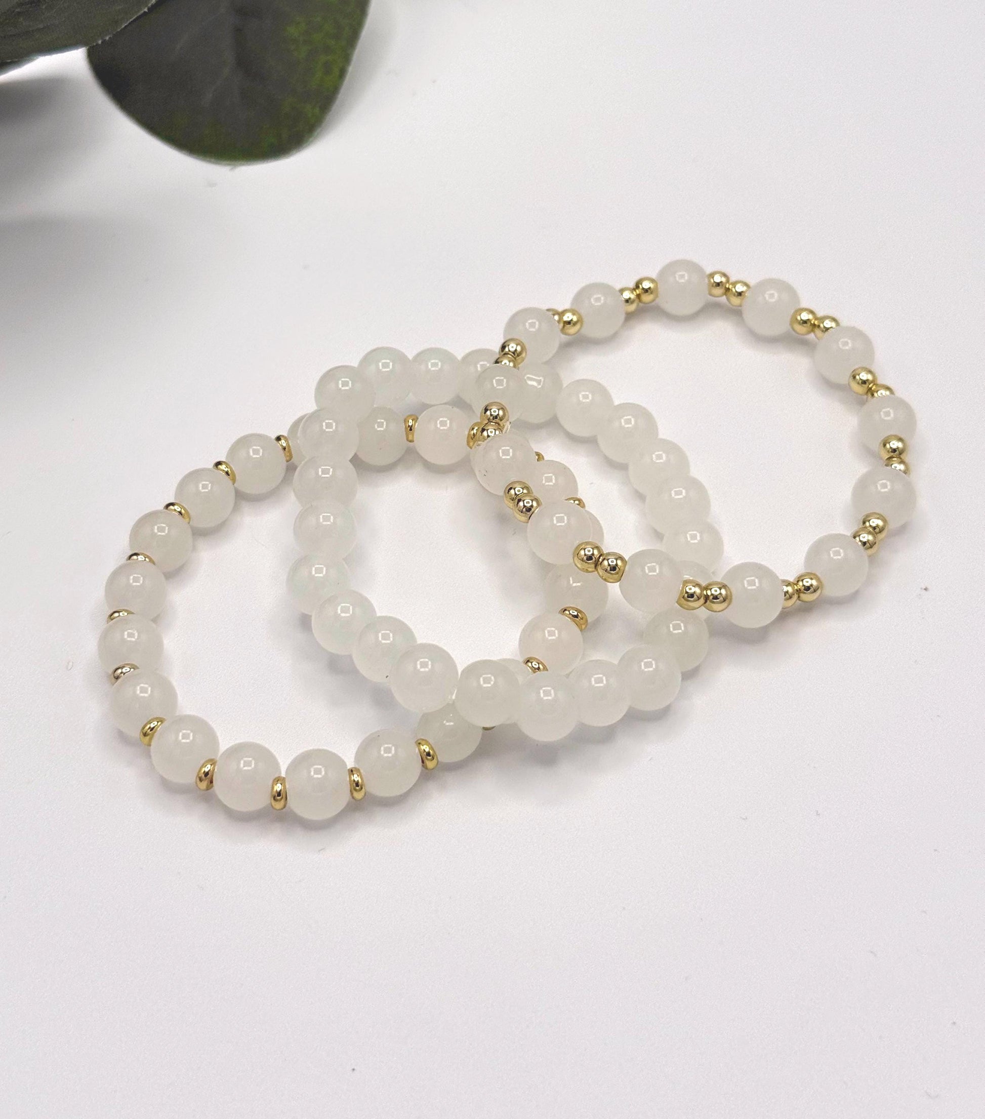 Casual Luxe: White Frosted Glass Bead Bracelet with Gold Spacers - Stretchy, No Clasp Design