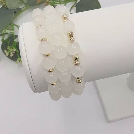 Casual Luxe: White Frosted Glass Bead Bracelet with Gold Spacers - Stretchy, No Clasp Design