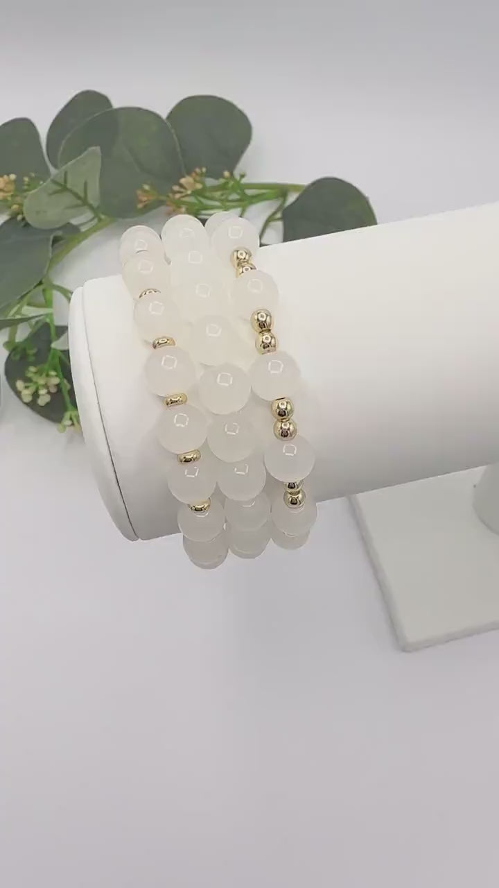 Casual Luxe: White Frosted Glass Bead Bracelet with Gold Spacers - Stretchy, No Clasp Design